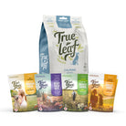 Trueleaf Calm and Treat bundle: a 600 g Calming Support chews pouch behind four bags of True Love treats, Pumpkin Patch, Berry Patch Bliss, Harvest Supper and Grilled Cheese.