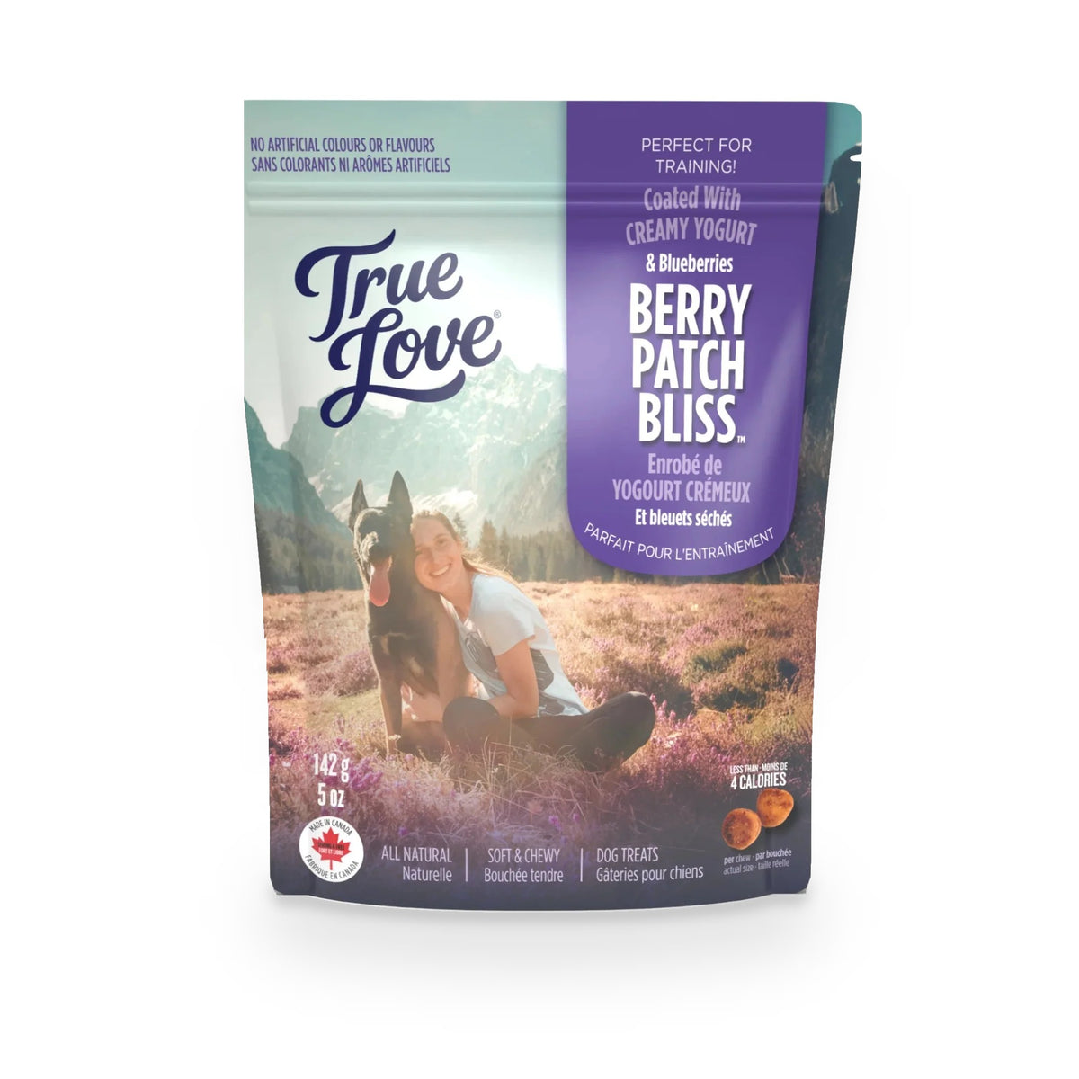 Bag of True Love dog treats with a girl and her dog on the front. Berry Patch Bliss - coated with creamy yogurt and blueberries.