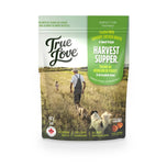 Bag of True Love dog treats with a prairie setting and two dogs on the front. Harvest Supper flavour - savoury chicken broth and sweet potato.